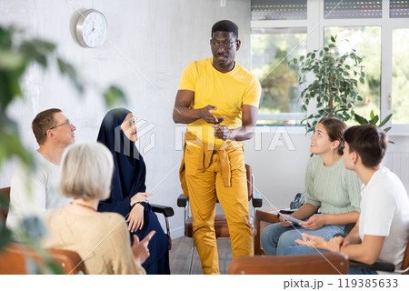 African american psychologist talking to group about psychological practices 119385633