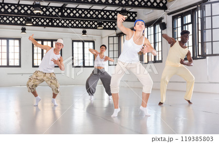 Dancers training movements in ballroom Dancers training movements in ballroom 119385803