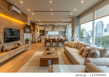 Large modern living room with a wooden floor and a large window 119386005