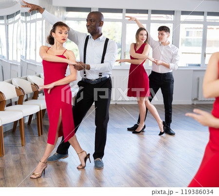 Adult man and adult woman dance tango Adult man and adult woman dance tango 119386034