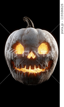 A pumpkin with a skull on it is lit up with a light A pumpkin with a skull on it is lit up with a light 119386626