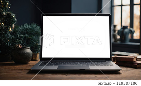 Laptop with a white screen mock up on table in the office of Christmas decor with bokeh lights, candles, overtime work on holidays, home office, Black Friday,. AI generated 119387180
