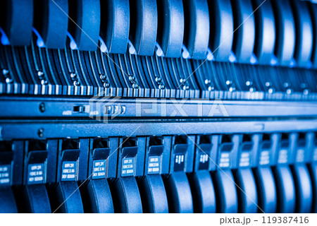 cluster of data storage SSD hard drives inside server rack 119387416