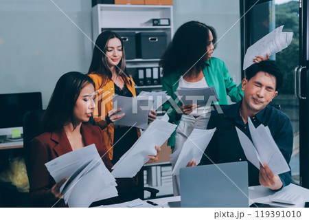 Stress, business people and employee frustrated with multitasking, pressure or overworked by team in chaos with paperwork. Anxiety, headache and worker overwhelmed by group and burnout in crisis 119391010