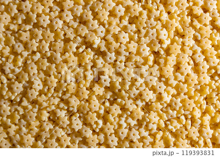 Uncooked Stelline Pasta Background Uncooked Stelline Pasta Background 119393831