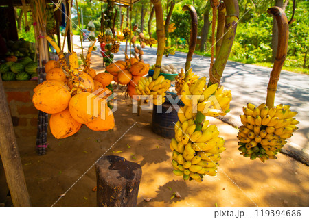 Road side fruit stall selling banana and other fruits Road side fruit stall selling banana and other fruits 119394686