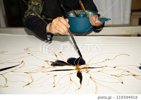 Batik design motif and pattern. traditional Malaysian fabric 119394918