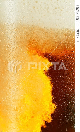 Closeup of beer bubbles in a glass. 119395293