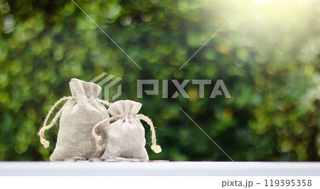 Small light bulbs decorated along a rustic wooden fence in a local restaurant, casting a warm, cozy glow. The soft lighting enhances the inviting atmosphere, creating a relaxed and intimate dining 119395358