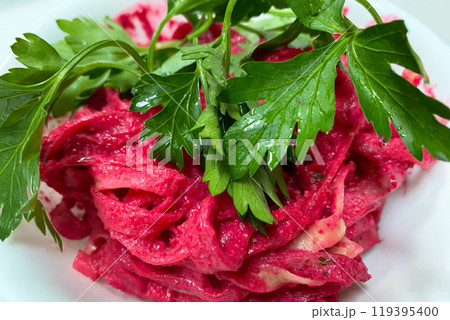 Tagliatelle pasta with hot pink sauce and parsley Tagliatelle pasta with hot pink sauce and parsley 119395400