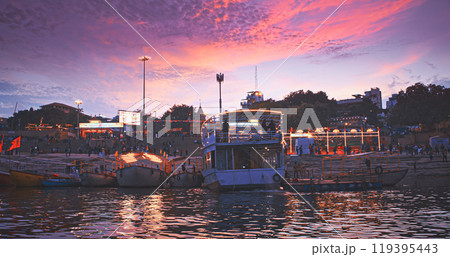 Varanasi, India. Hundreds Of Tourists And Locals Gather On Boats To Watch Fire Ceremony Or Puja At Assi Ghat. Ganga Maha Aarti Ceremony. Traditional Ganga Aarti In Varanasi. Cinematic Camera Movement 119395443