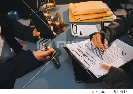 Judge gavel with Justice lawyers having team meeting at law firm background. Concepts of Law and Legal services. Judge gavel with Justice lawyers having team meeting at law firm background. Concepts of Law and Legal services. 119396370