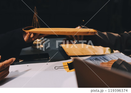 Judge gavel with Justice lawyers having team meeting at law firm background. Concepts of Law and Legal services. Judge gavel with Justice lawyers having team meeting at law firm background. Concepts of Law and Legal services. 119396374