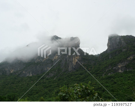 Cloud and fog cover limestone mountain in the rainy season, Green forest and rock at Khao Sam Roi Yot National Park, Thailand Cloud and fog cover limestone mountain in the rainy season, Green forest and rock at Khao Sam Roi Yot National Park, Thailand 119397527