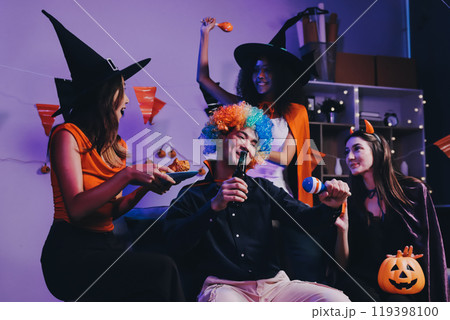 Joyful office Halloween party with coworkers in costumes, celebrating with drinks and laughter, fostering teamwork and festive spirit 119398100