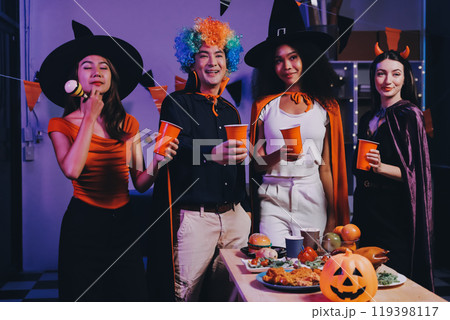 Joyful office Halloween party with coworkers in costumes, celebrating with drinks and laughter, fostering teamwork and festive spirit Joyful office Halloween party with coworkers in costumes, celebrating with drinks and laughter, fostering teamwork and festive spirit 119398117