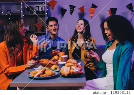 Joyful office Halloween party with coworkers in costumes, celebrating with drinks and laughter, fostering teamwork and festive spirit Joyful office Halloween party with coworkers in costumes, celebrating with drinks and laughter, fostering teamwork and festive spirit 119398132