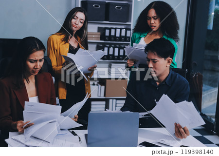 Stress, business people and employee frustrated with multitasking, pressure or overworked by team in chaos with paperwork. Anxiety, headache and worker overwhelmed by group and burnout in crisis 119398140