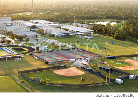 Sports facilities at public school in Florida, USA. American football stadium, tennis court and baseball diamond sport infrastructure Sports facilities at public school in Florida, USA. American football stadium, tennis court and baseball diamond sport infrastructure 119399196