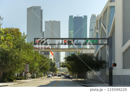 Traffic lights regulating driving cars on city street in Miami, Florida Traffic lights regulating driving cars on city street in Miami, Florida 119399220
