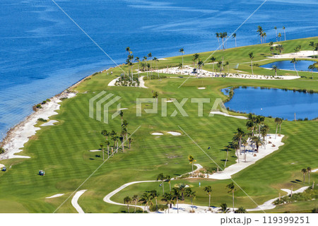 Waterfront golf course in Florida. Sports grounds with green grass in Boca Grande, small town on Gasparilla Island Waterfront golf course in Florida. Sports grounds with green grass in Boca Grande, small town on Gasparilla Island 119399251