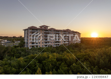 New apartment condo building in Florida suburban area. Family housing in quiet neighborhood. Real estate development in American suburbs New apartment condo building in Florida suburban area. Family housing in quiet neighborhood. Real estate development in American suburbs 119399447