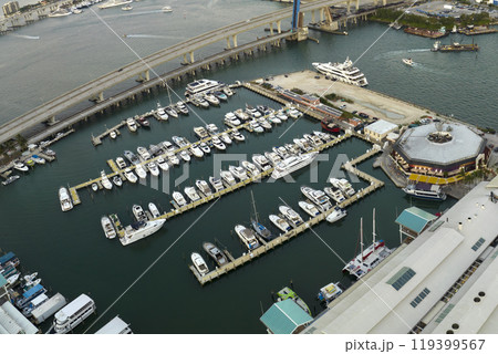 Expensive yachts and motorboats docked in Biscayne Bay harbor in downtown district of Miami, Florida. Marina bay with luxury sailboats 119399567