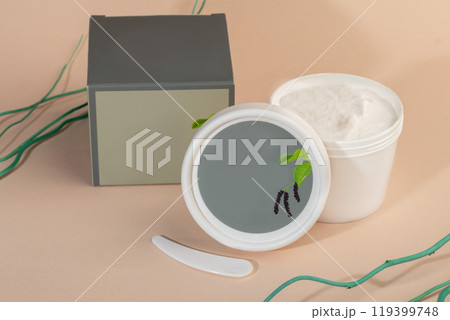 Face mask with spatula on light background. Cosmetic procedures. Face mask with spatula on light background. Cosmetic procedures. 119399748