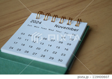 Side view of November 2024 calendar on wooden desk. Calendar concept. 119400607