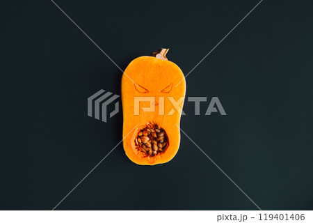 Butternut squash carved with spooky face, showcasing creative Halloween decoration ideas 119401406