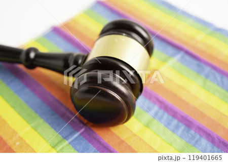 Gavel for judge lawyer on rainbow flag, symbol of LGBT pride month. Gavel for judge lawyer on rainbow flag, symbol of LGBT pride month. 119401665