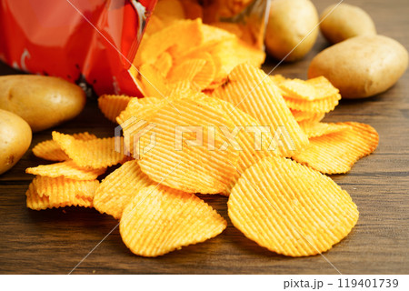 Potato chips , delicious BBQ seasoning spicy for crips, thin slice deep fried snack fast food. Potato chips , delicious BBQ seasoning spicy for crips, thin slice deep fried snack fast food. 119401739