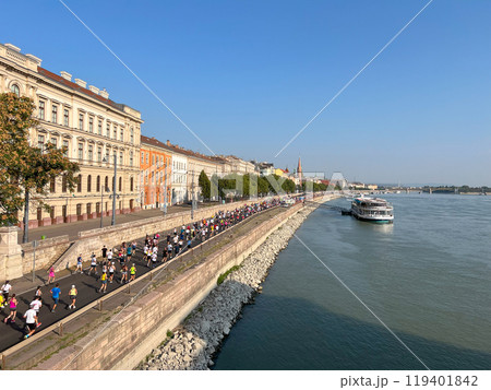 crowd people running marathon race along embankment in Budapest 119401842