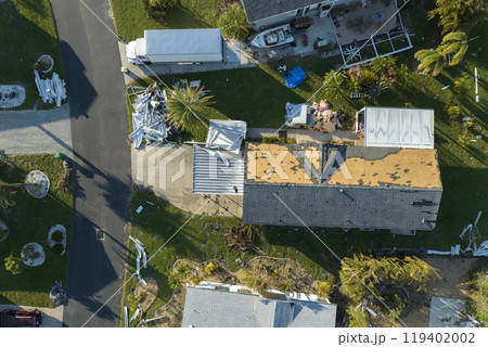 Consequences of natural disaster. Severely damaged houses after hurricane Ian in Florida mobile home residential area 119402002
