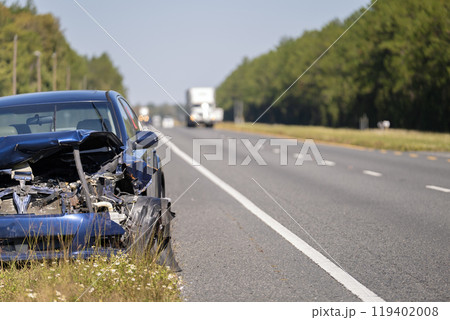 Crashed car damaged in traffic accident parked on road side. Abandoned broken vehicle Crashed car damaged in traffic accident parked on road side. Abandoned broken vehicle 119402008