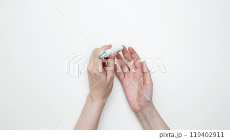 Woman using glucometer for testing level Blood sugar. Top view 119402911