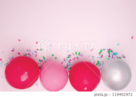 Birthday attributes colorful balloons and confetti. Concept of festive birthday celebrations Birthday attributes colorful balloons and confetti. Concept of festive birthday celebrations 119402972