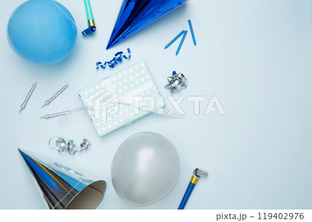 Birthday attributes colorful balloons, party hats, candles, and confetti. Concept of festive birthday celebrations Birthday attributes colorful balloons, party hats, candles, and confetti. Concept of festive birthday celebrations 119402976