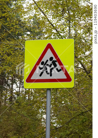 Road sign, installed near schools. Be careful, children. image of running people Road sign, installed near schools. Be careful, children. image of running people 119403690