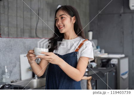 Young Barista Skillfully Preparing Coffee in a Modern cafe Setting with Professional Equipment and a Warm Smile Young Barista Skillfully Preparing Coffee in a Modern cafe Setting with Professional Equipment and a Warm Smile 119403739