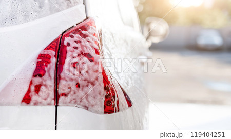 Car headlight covered with foam 119404251