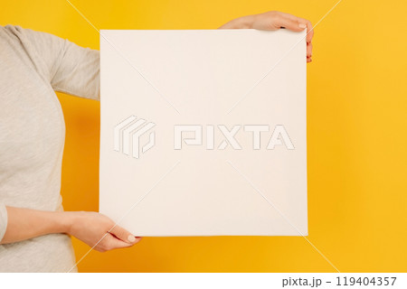 Hand holding white canvas Hand holding white canvas 119404357