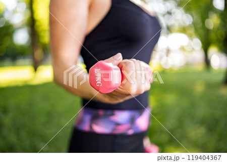 Girl doing workout outdoors 119404367