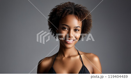 African American Woman Smiling in Simple Black Bikini Portrait shot with soft natural lighting showcasing African American Woman Smiling in Simple Black Bikini Portrait shot with soft natural lighting showcasing 119404489
