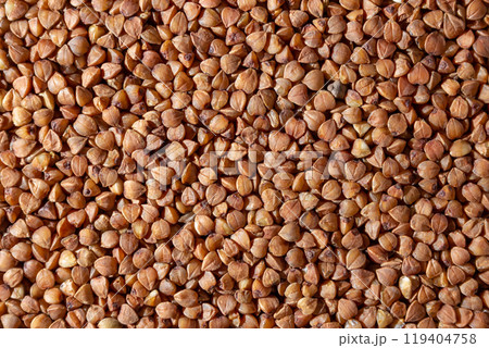 Dry Uncooked Brown Buckwheat Groats Background 119404758