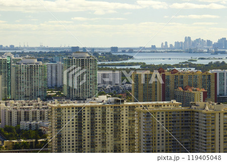 Aerial view of Sunny Isles Beach city with luxurious highrise hotels and condos on Atlantic ocean shore. American tourism infrastructure in southern Florida 119405048