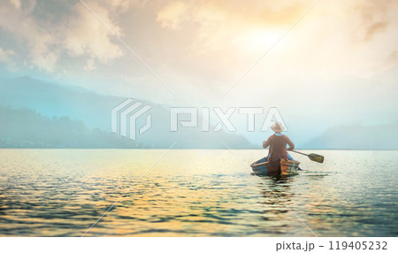 Lonely fisherman on morning lake Lonely fisherman on morning lake 119405232
