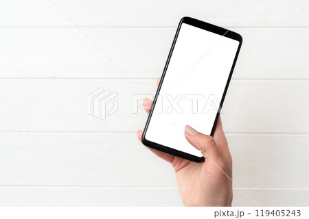 User holding smartphone with white screen 119405243