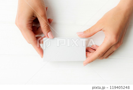 White business card in girl hands 119405248