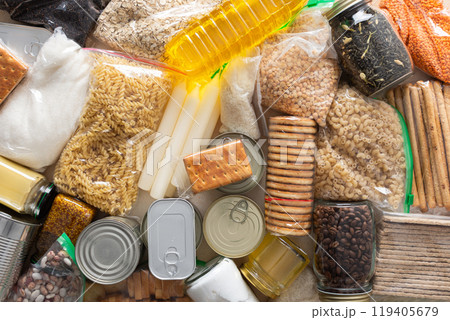 Canned goods, cereals, and pasta stored for quarantine and isolation, ensuring long-term survival and food security at home, survival during military operations, the concept of stay at home 119405679